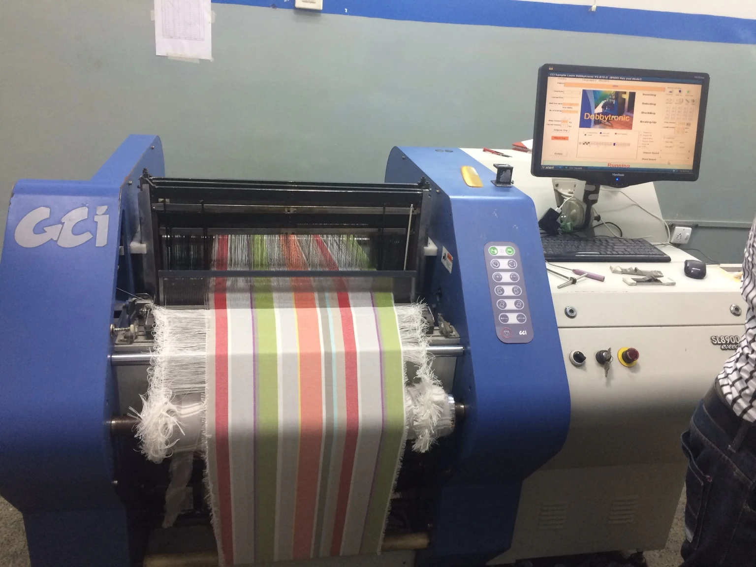 Modern sample weaving and fabric development machine used within a textile development facility