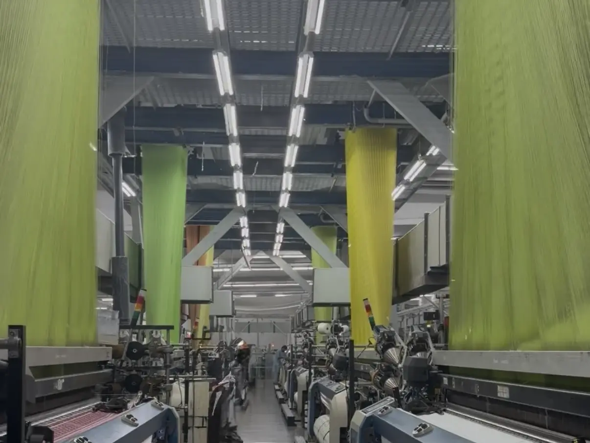 Original modern weaving hall photograph within a selected supplier mill